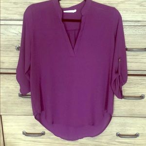 Purple blouse with button detailing on the arm!